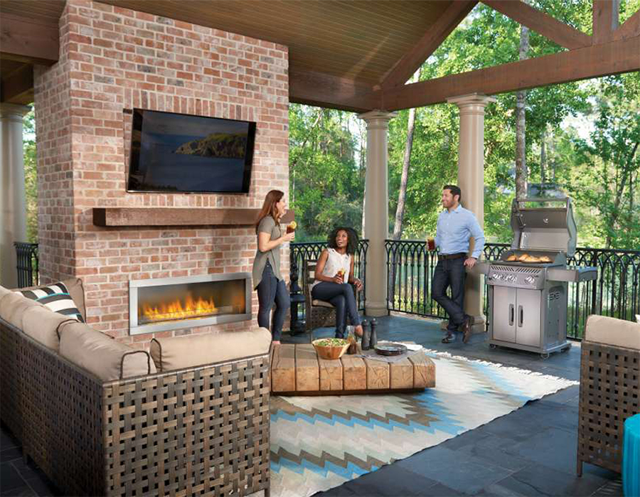Rogue R425SIB Lifestyle covered patio fireplace with friends lid open.jpg